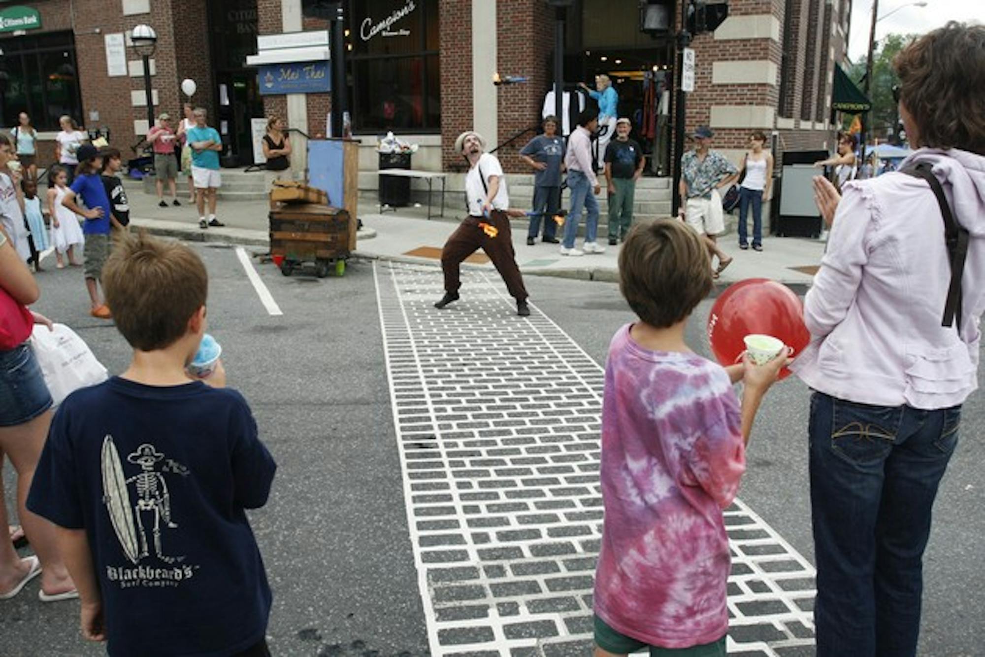 As food vendors packed the sidewalks of Main Street, Hanover retailers such as Juliana, Bella and Folk used the StreetFest as an opportunity to sell items remaining from previous seasons at reduced prices.