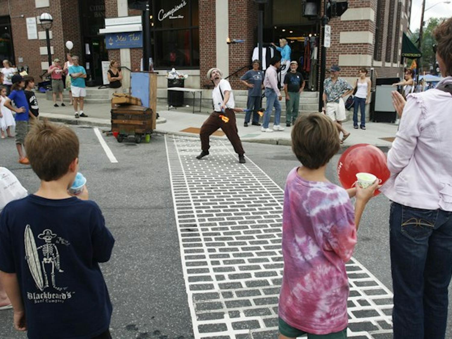 As food vendors packed the sidewalks of Main Street, Hanover retailers such as Juliana, Bella and Folk used the StreetFest as an opportunity to sell items remaining from previous seasons at reduced prices.
