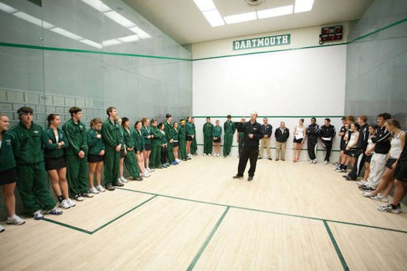 Squash head coach Hansi Wiens speaks to members of the men's and women's teams in October 2010.