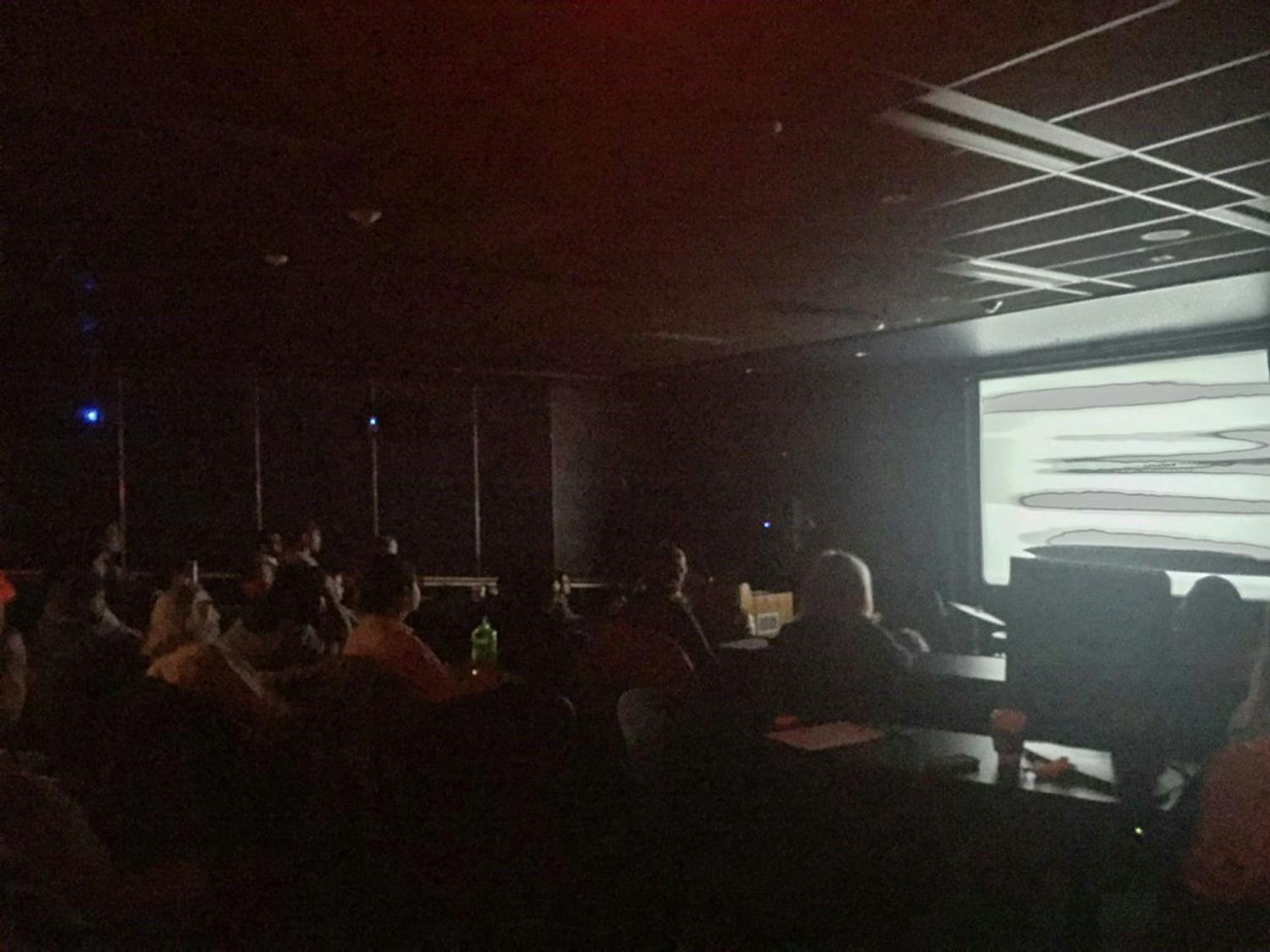 Audience members watch an opening film at Tuesday’s EYEWASH.
