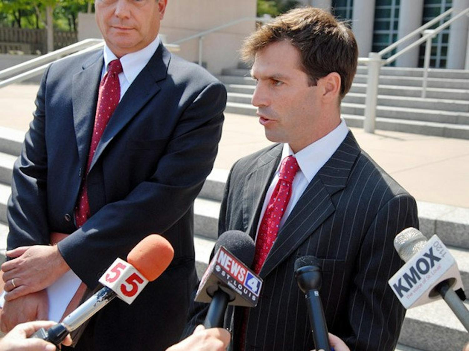 Former Missouri State Senator Jeff Smith (center), 37, speaks with members of the media on the steps of the Thomas F. Eagleton United States Courthouse in St. Louis Tuesday, Aug. 25, 2009. Smith plead guilty to two counts of conspiracy to obstruct justice in relationship to an investigation of his losing 2004 run for Congress. Smith resigned his seat in the state senate today. At left is attorney Richard Greenberg. (AP PHOTO/Sid Hastings)
BC-MO--Lawmakers-Investigation