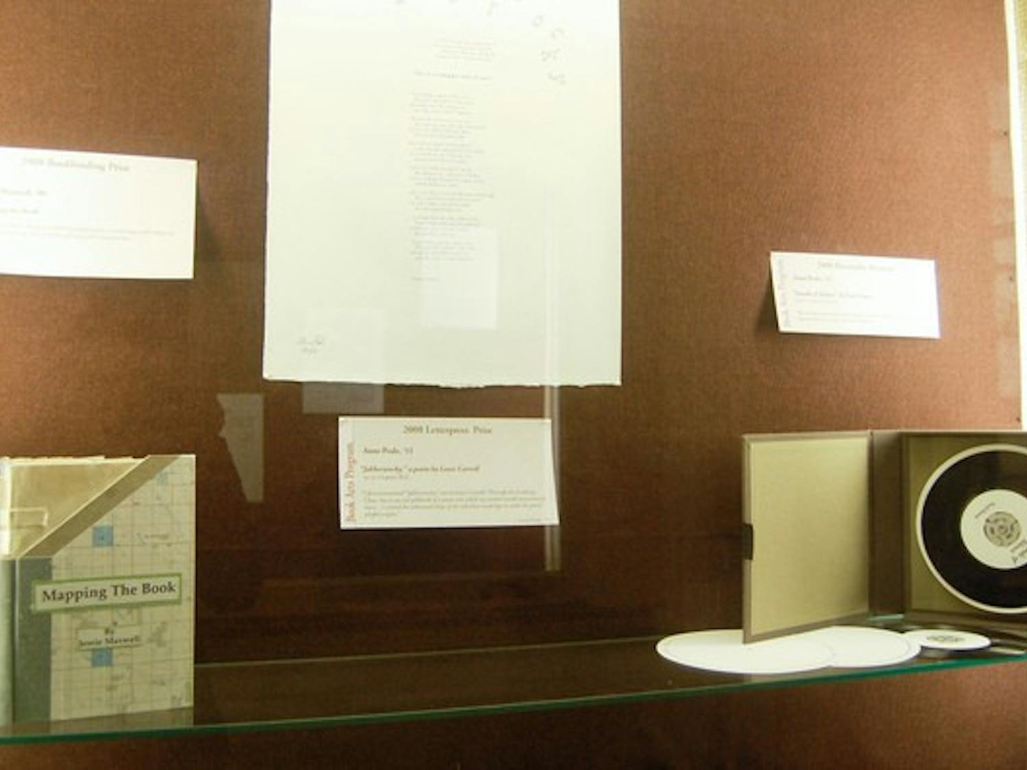 Student work from the book arts studios, located in the basement corridor between Baker and Sanborn Libraries, is on display in the main corridor of Baker Library.