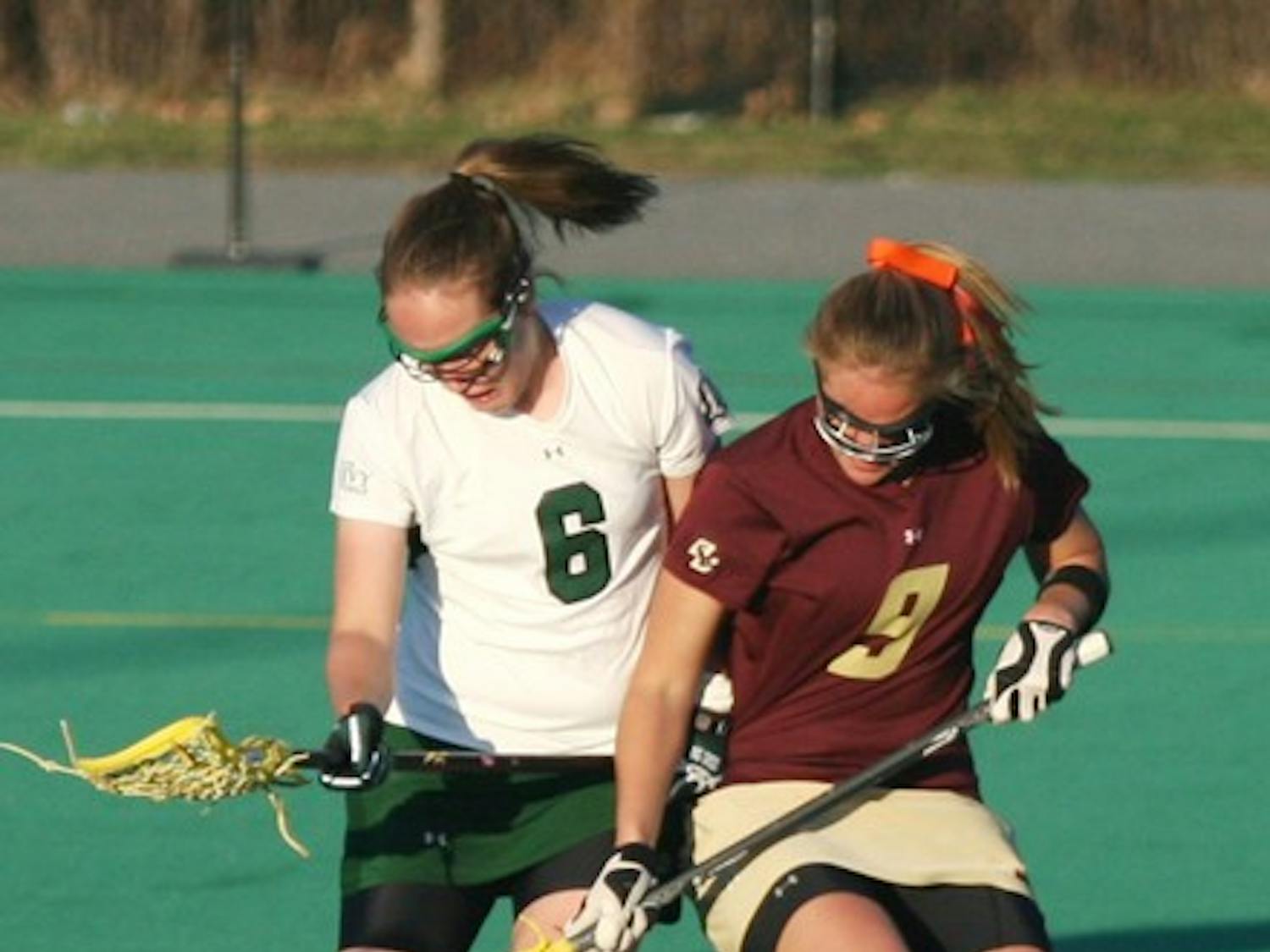 Colleen Olsen '10 battles for a ground ball in Tuesday's 13-9 victory.