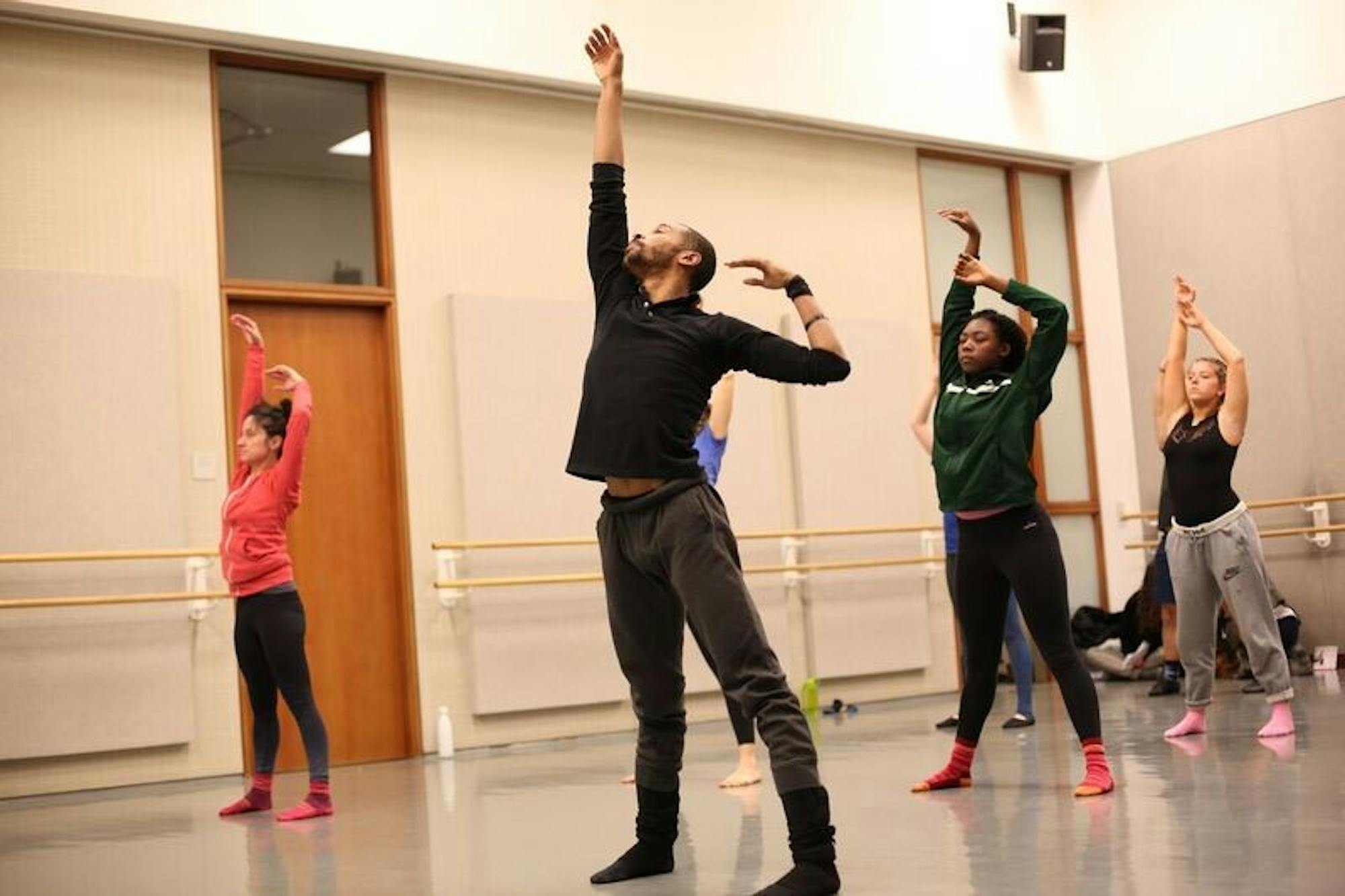 Warmups at a master class offered by members of the Malpaso Dance Company required dancers to engage in fluid movements that define the group's style.
