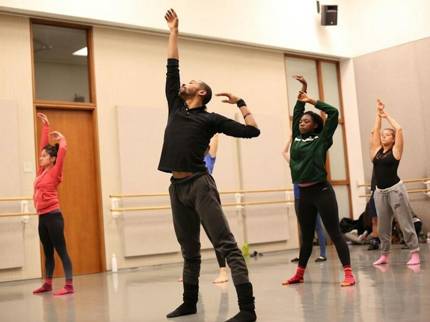 Warmups at a master class offered by members of the Malpaso Dance Company required dancers to engage in fluid movements that define the group's style.