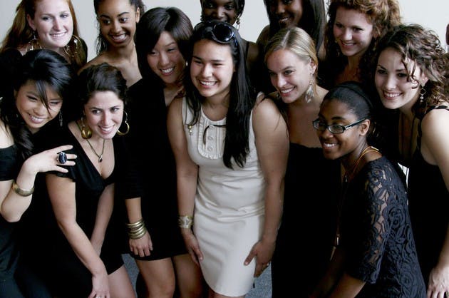Jennifer Lopez '08 poses with the students who modeled her jewelry in a recent show at the Hop.