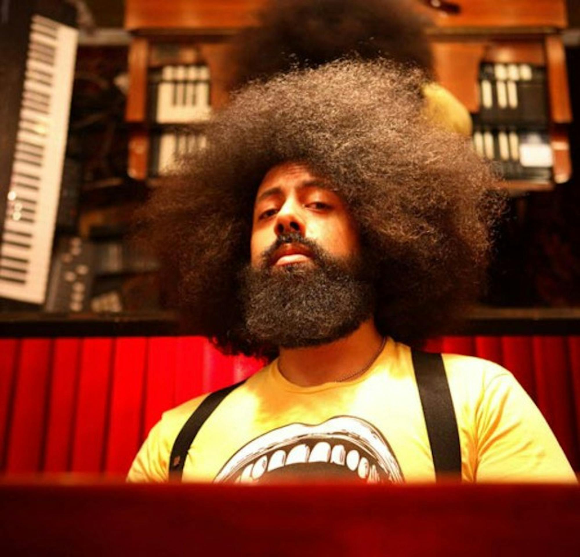 Popular comedian Reggie Watts, who will perform this Saturday night, has given a TED talk and created a parody of Radiohead.