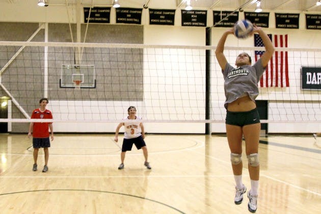 Tim Connor '13 prepares to get spiked in the face. Jonathan Katz '12 watches.