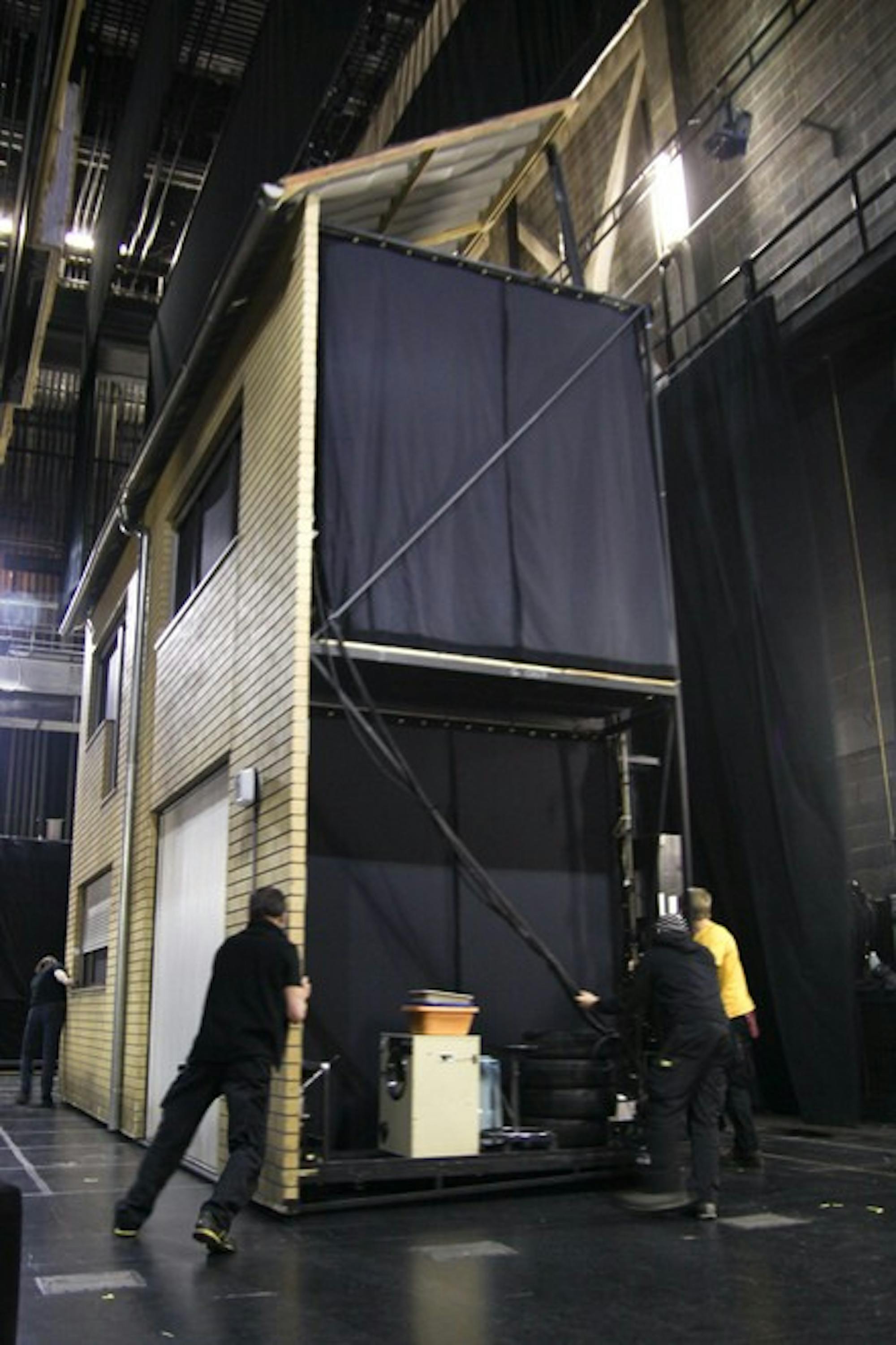 A two-story house accompanies the second tableaux in Henier Goebbels' musical staging of classic texts, which was performed at Dartmouth this weekend.