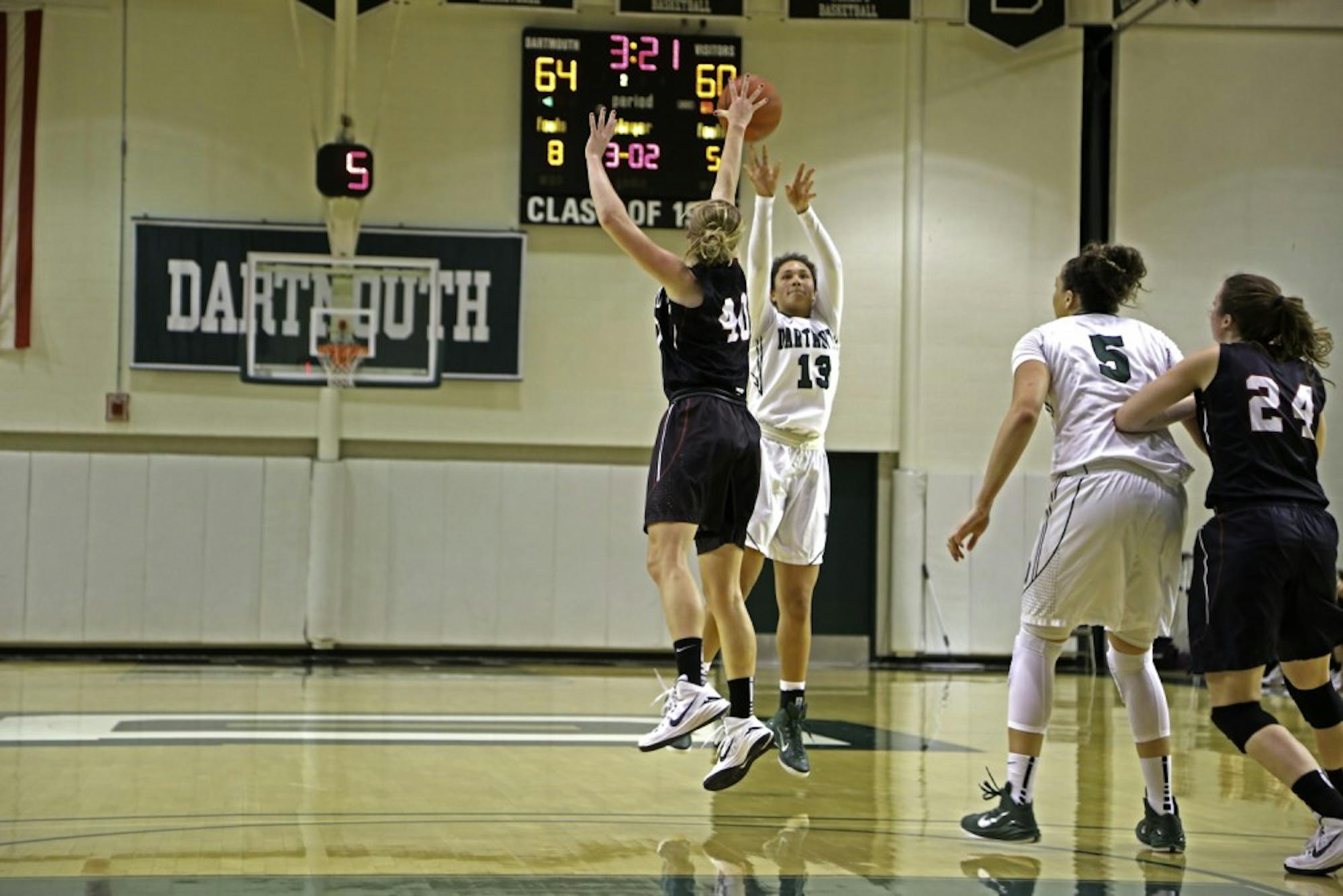 Lakin Roland ’16 goes up for a contested shot during Saturday’s last minute loss to Harvard University.