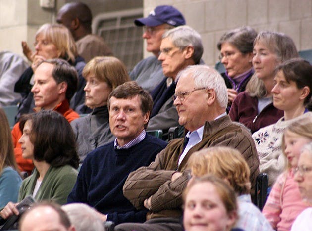 Board Chairman Ed Haldeman '70 and College President James Wright watch the women's basketball team defeat Columbia on Saturday night.