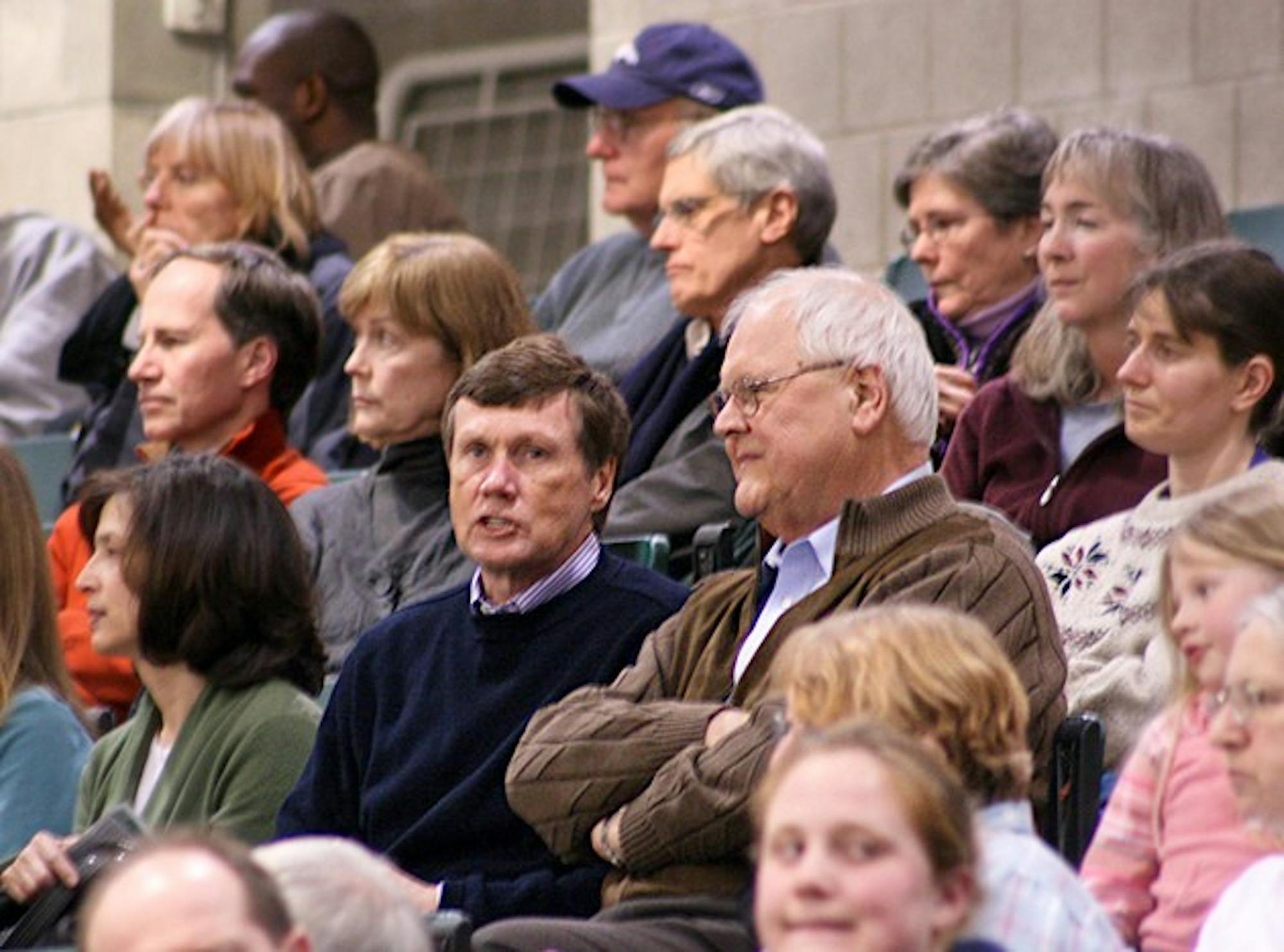 Board Chairman Ed Haldeman '70 and College President James Wright watch the women's basketball team defeat Columbia on Saturday night.