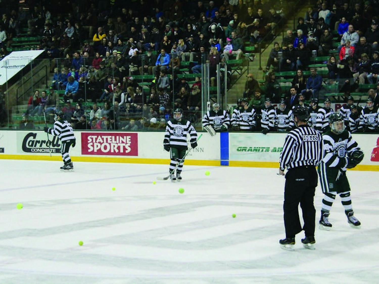 Per tradition, fans throw tennis balls onto the ice after the first Dartmouth goal against Princeton University.