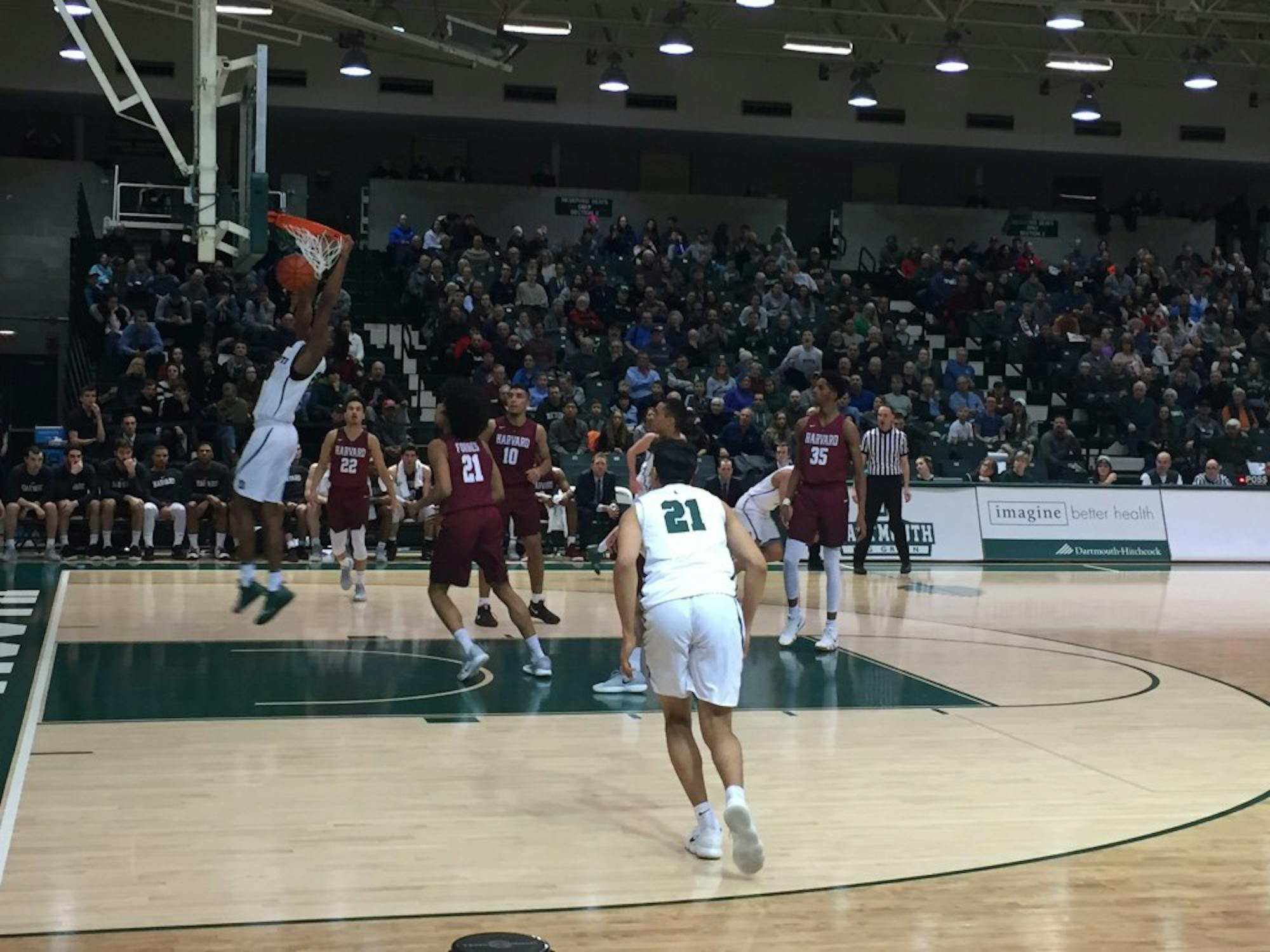 Chris Knight '21 dunked the ball during Dartmouth's 81-63 win over Harvard Saturday night. Knight scored 20 points in the game.