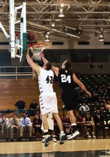 The Big Green men's basketball team narrowly fell to Harvard in its first conference match of the season on Saturday.