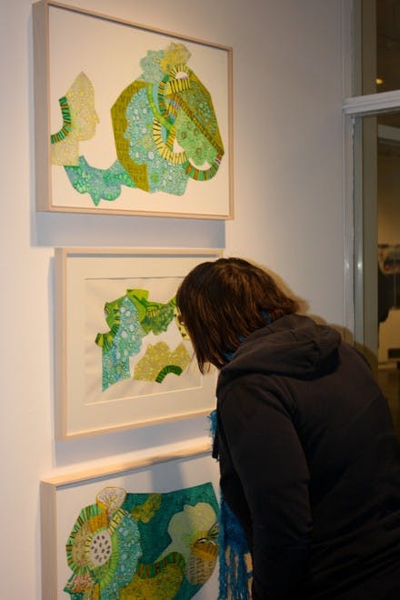 Esm Thompson's exhibition of paintings and collages, on display at the Strauss Gallery, brings vibrant colors and patterns to the Hop.