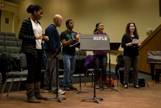 Back-up singers rehearse for the final round of 