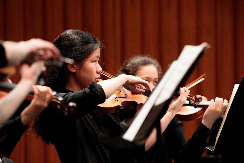Students in the DSO rehearse for their upcoming performance.