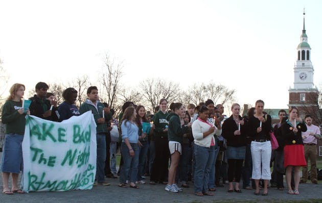 Students participating in 'Take Back the Night' gather in the center of the Green on Wednesday evening to rally against sexual assault.