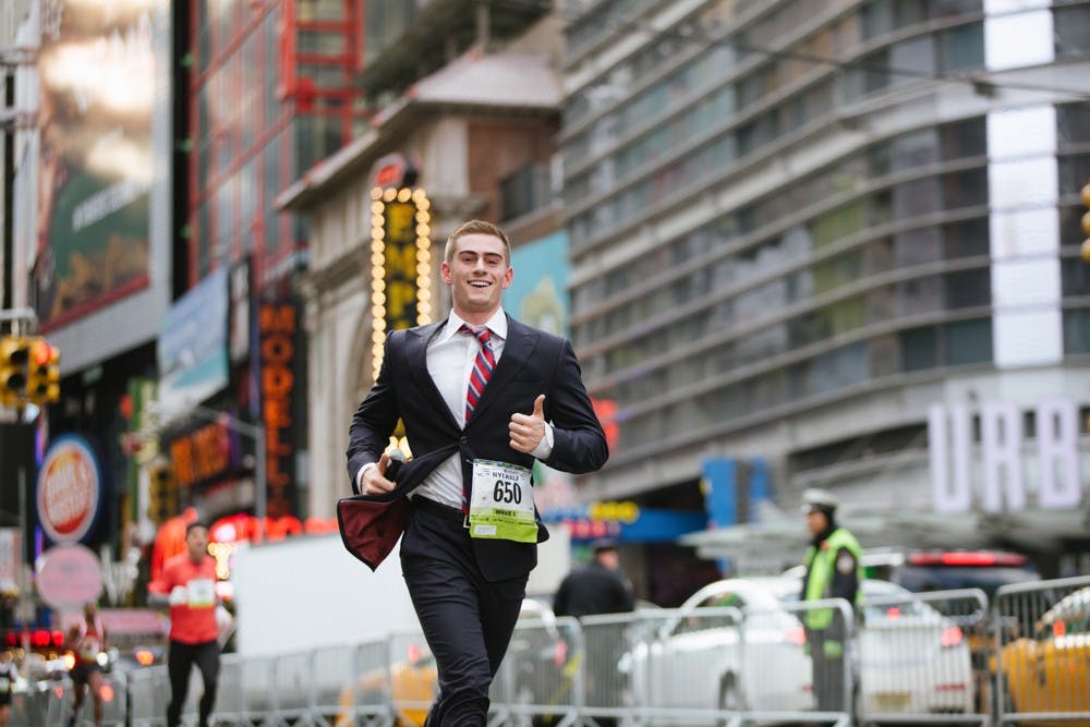 Rex Woodbury '15 smiles while running the half-marathon.