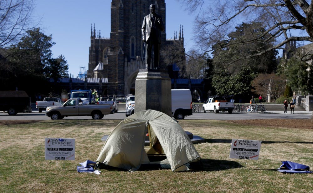 A tent was set up in front of the James B. Duke statue to raise awareness for livable wage issues.