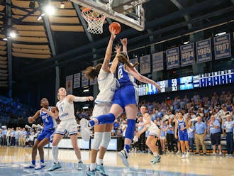 Kennedy Brown races under the basket for a reverse layup attempt against North Carolina.