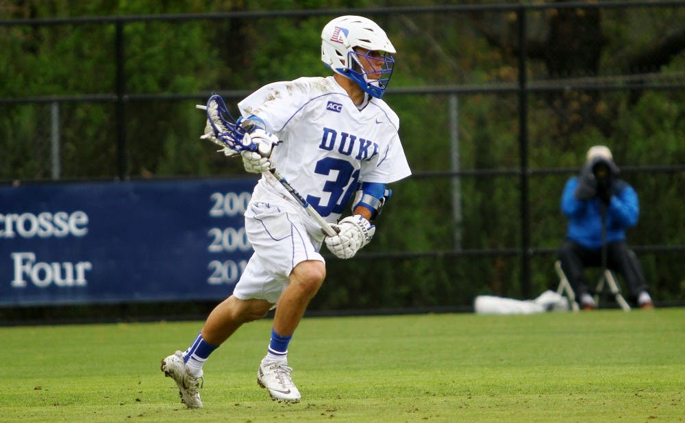 Senior Jordan Wolf tallied six goals and added a pair of assists as Duke routed Rutgers 17-8 on Senior Day at Koskinen Stadium.