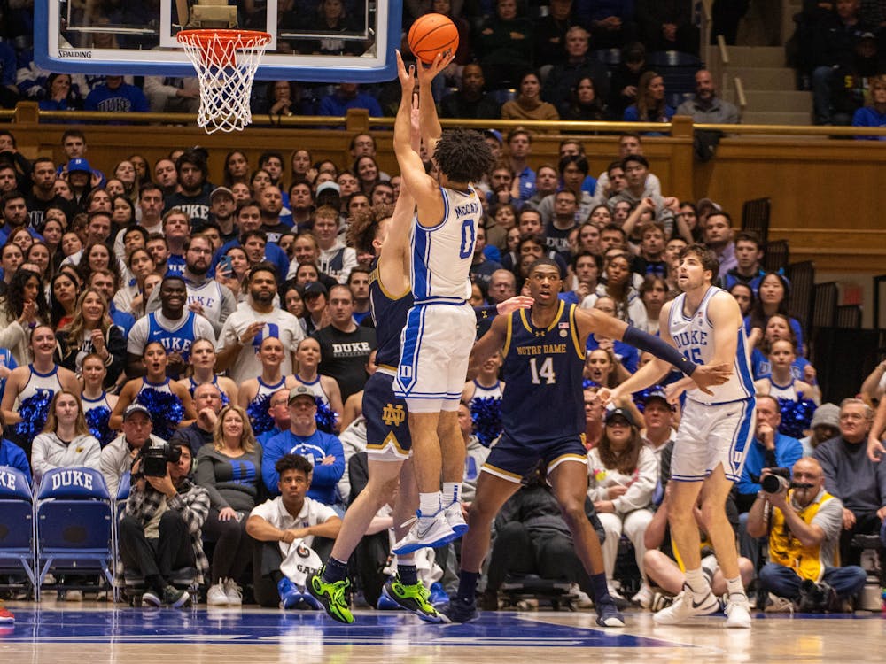 Jared McCain shoots over a defender during Duke's win against Notre Dame.