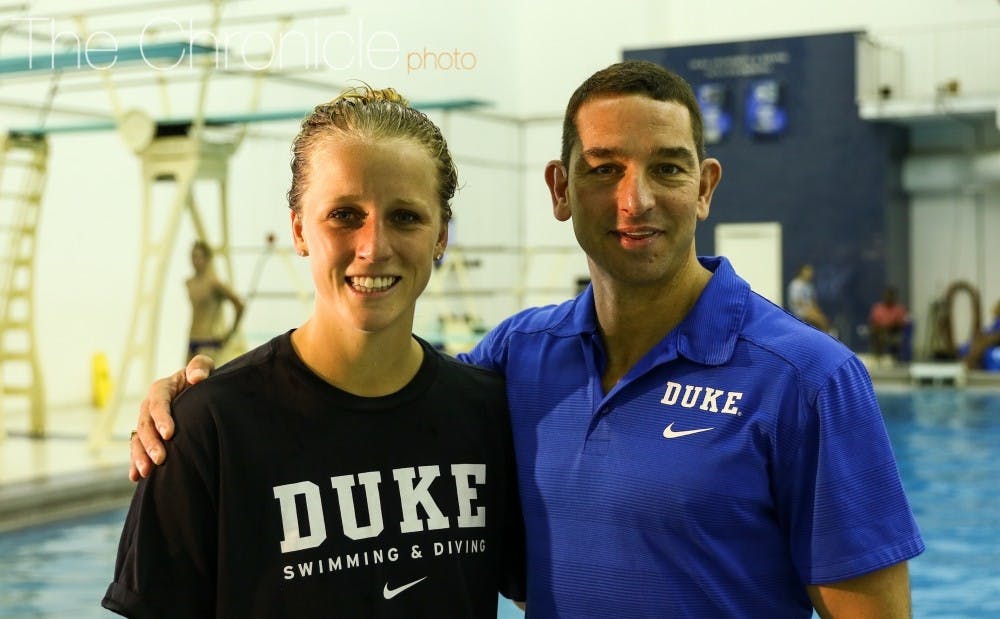 <p>Medical student and 2012 silver medalist Abby Johnston and Duke diving head coach Nunzio Esposto are two of the University's 12 Olympians this year.</p>