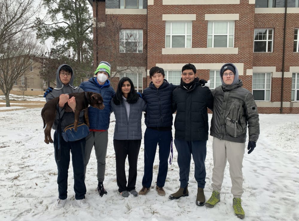 Pictured, left to right: Billy Cao (holding Scoot), Nicholas Sortisio, Vidita Shah, Eric Song and Dimitrii Khitrin.