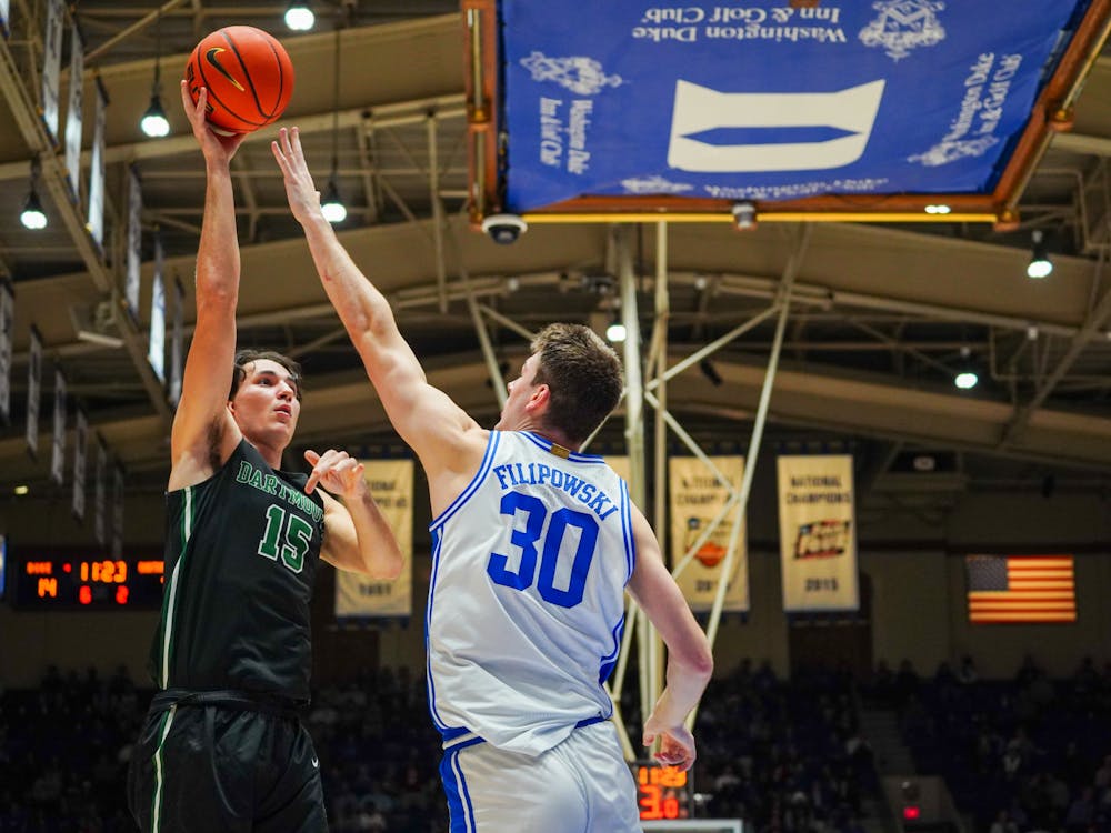 Sophomore center Kyle Filipowski goes for the block in No. 2 Duke men's basketball's Nov. 6 game against Dartmouth.