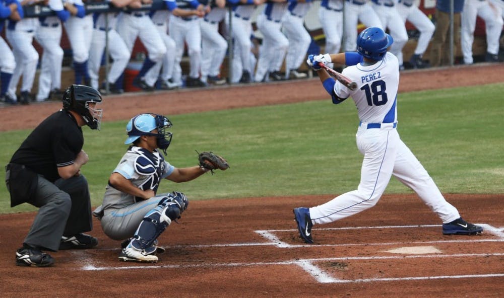 <p>Junior Cris Perez scored Duke's only run Saturday before the game was called after four innings.&nbsp;</p>