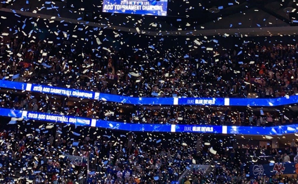 Confetti showered the court in Charlotte after Duke won the ACC title. 