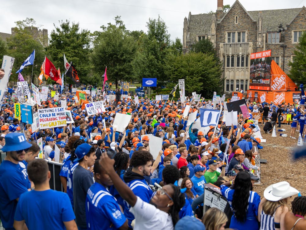 Duke students hoist hand-crafted signs in front of the College GameDay cameras.
