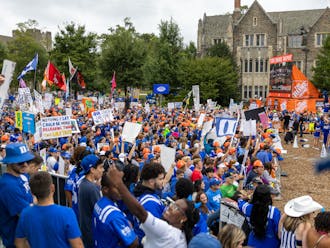 Duke students hoist hand-crafted signs in front of the College GameDay cameras.