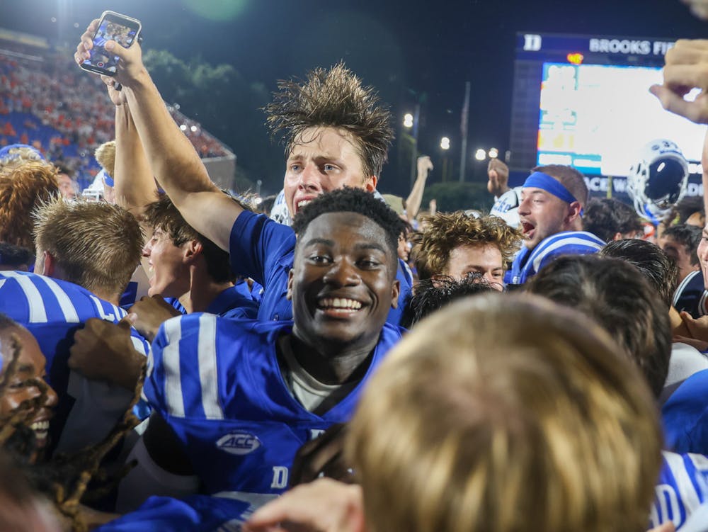 Duke students stormed the field after the Blue Devils' win against Clemson — their first top-10 win since 1989.