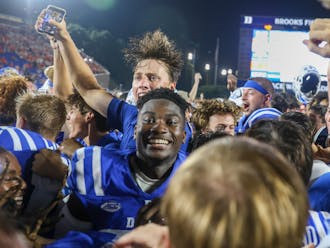 Duke students stormed the field after the Blue Devils' win against Clemson — their first top-10 win since 1989.