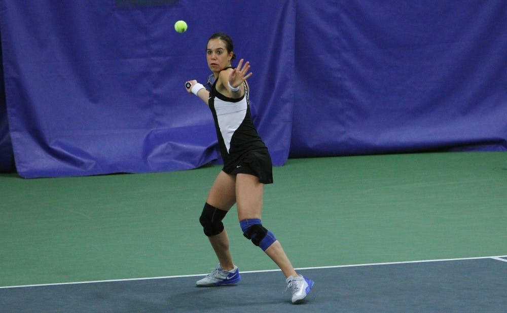 Playing as the Blue Devils' top seed, Capra was the first to finish her match, winning 6-1, 6-0.