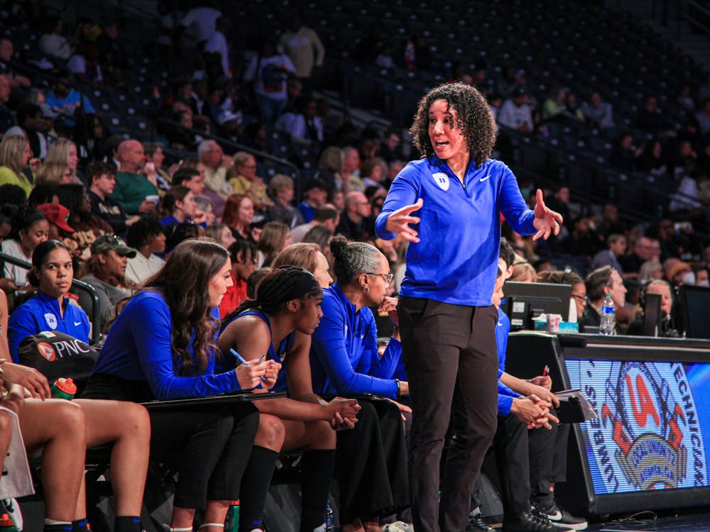 Coach Kara Lawson talks to her bench during a game