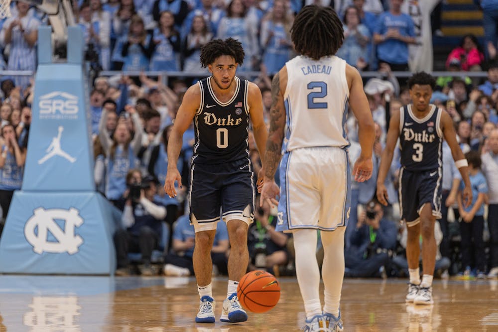 Freshman guard Jared McCain stares down the Tar Heels' Elliot Cadeau in 84-93 loss to North Carolina.