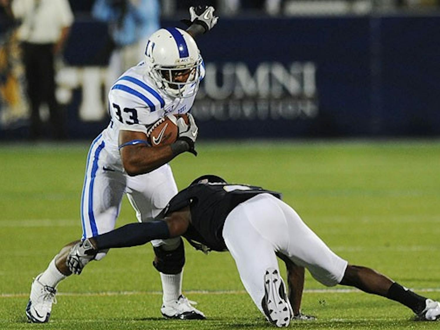 Duke running back Desmond Scott breaks a tackle midway through the Blue Devils’ comeback win over FIU.
