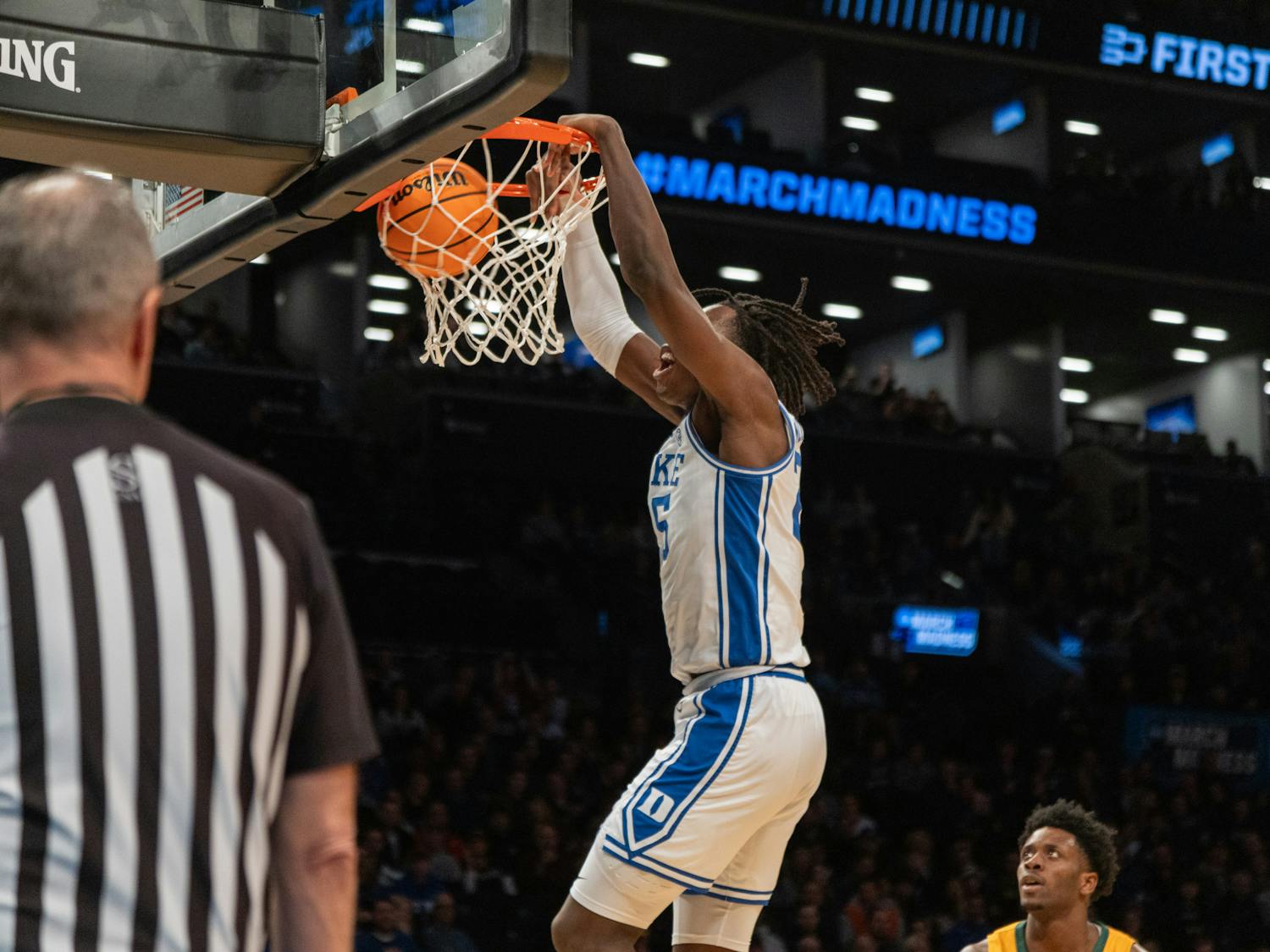 Sophomore forward Mark Mitchell rises for a dunk in Duke's first-round NCAA tournament game against Vermont.