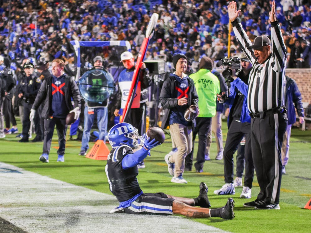 Duke football's Eli Pancol celebrates after scoring his third touchdown. 