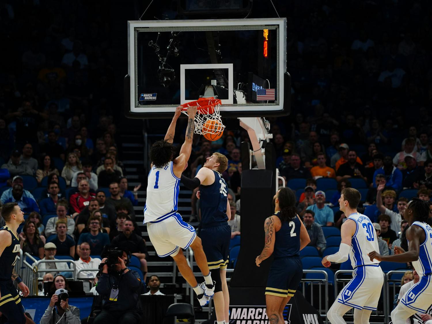 Freshman center Dereck Lively II slams home the opening points of Duke's Round of 64 win against Oral Roberts.