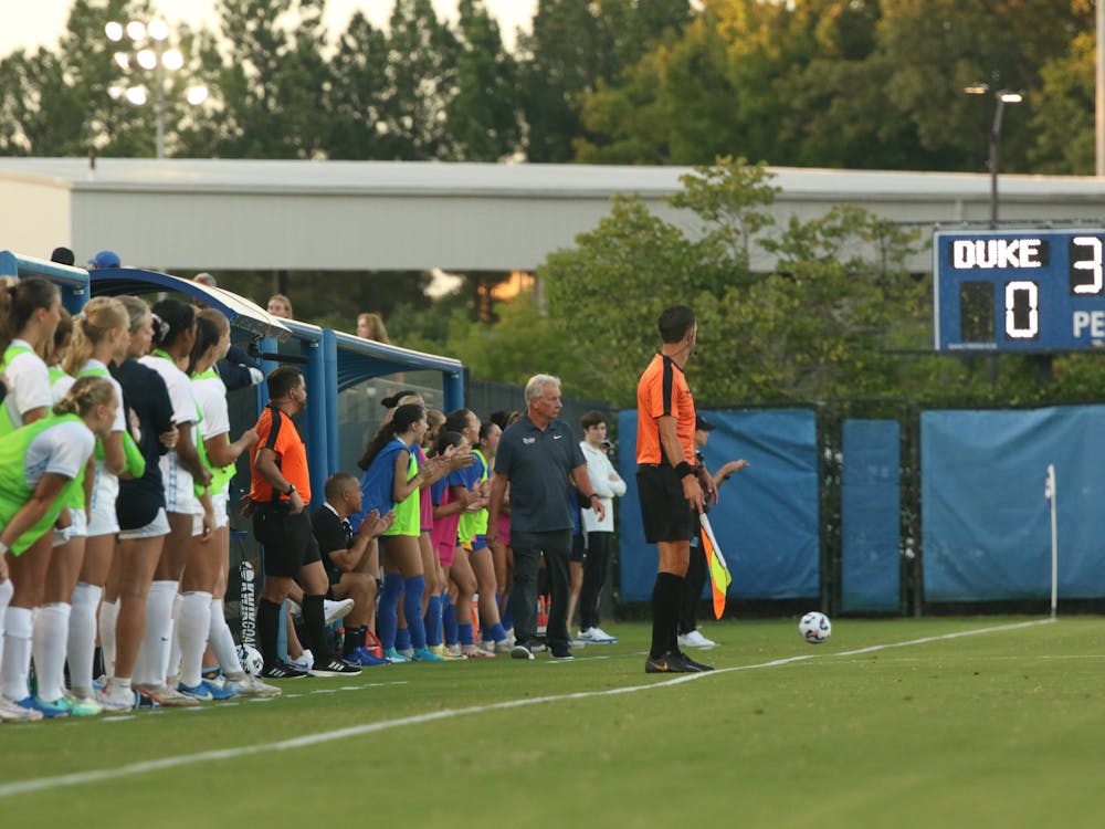 Robbie Church coaches his final Duke women's soccer team. 