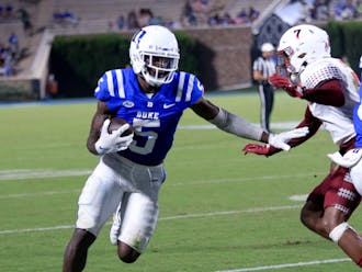 Wide receiver Jason Calhoun pushes away a defender during Duke's 2022 victory against Temple.