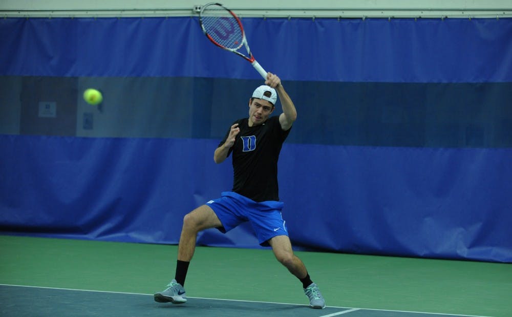 In the Blue Devils' last match, senior Raphael Hemmeler joined head coach Ramsey Smith as one of five players in program history to reach the 100-win plateau in both singles and doubles play.