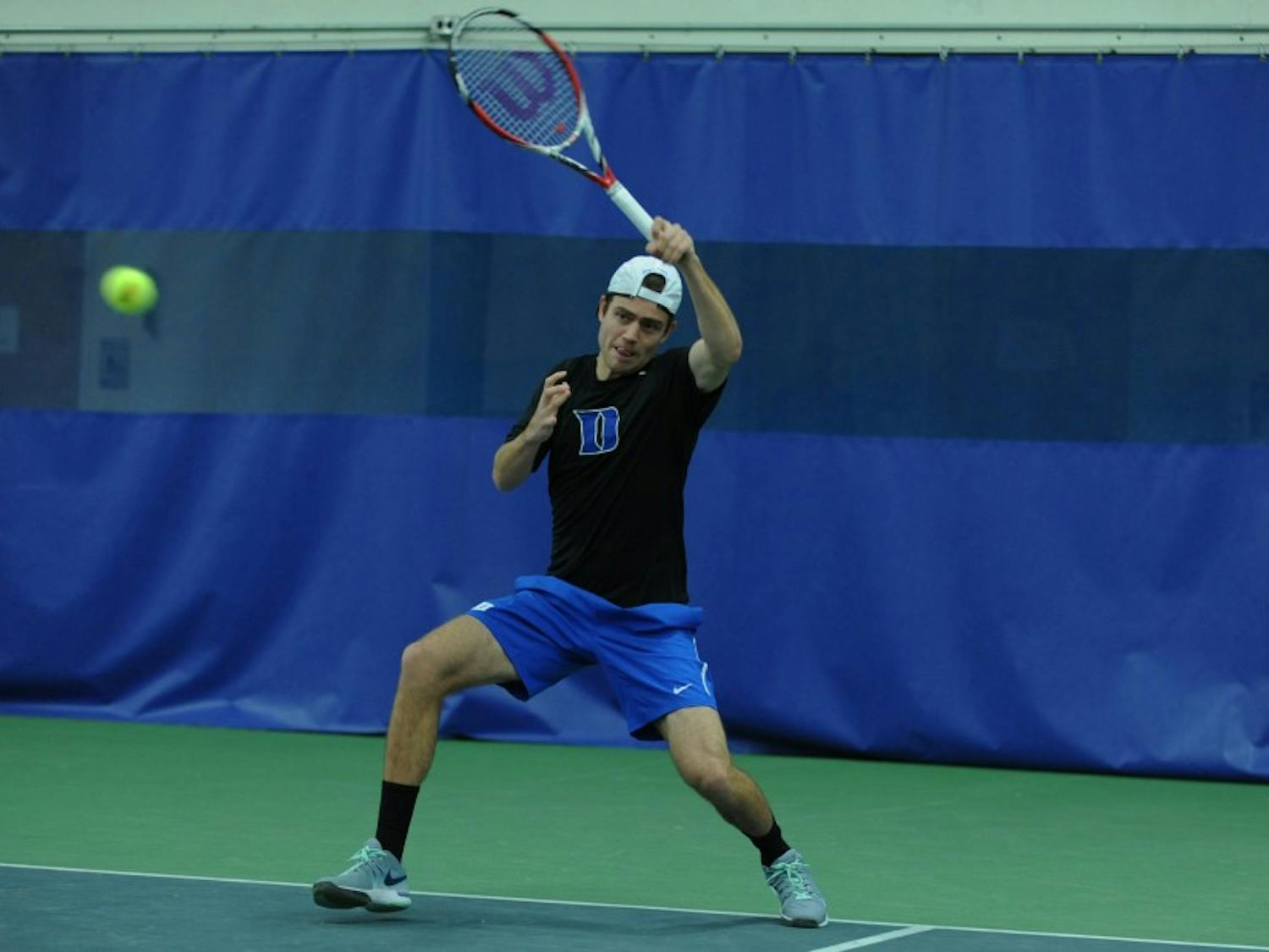 In the Blue Devils' last match, senior Raphael Hemmeler joined head coach Ramsey Smith as one of five players in program history to reach the 100-win plateau in both singles and doubles play.