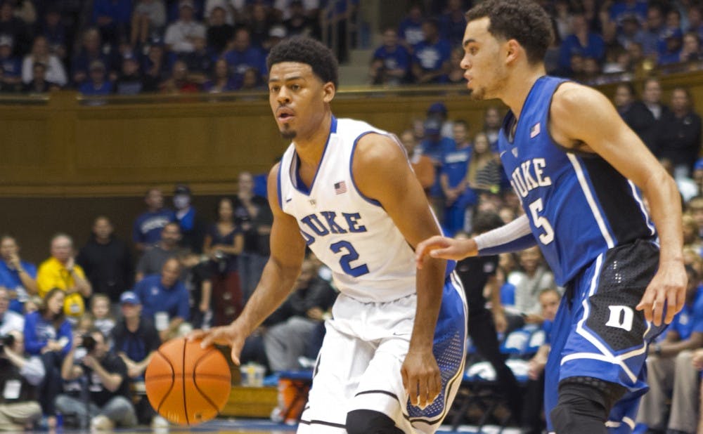 Senior Quinn Cook (left) and freshman Tyus Jones will look to continue to develop chemistry in the backcourt during Duke’s first exhibition game of the season Tuesday night against Livingstone.