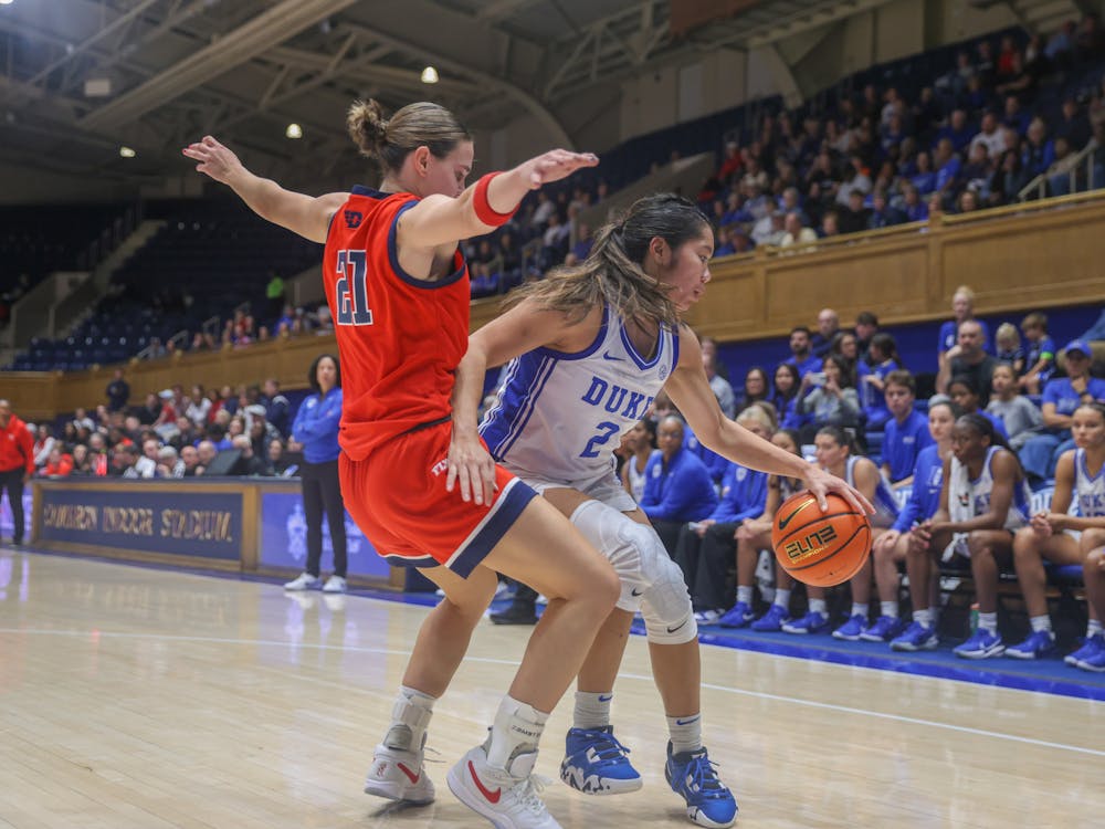 Vanessa de Jesus dribbles around a Dayton defender. 